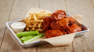 BJ’s Sauced 'n' Tossed Chicken Thighs & Fries from Our Appetizers Menu ...